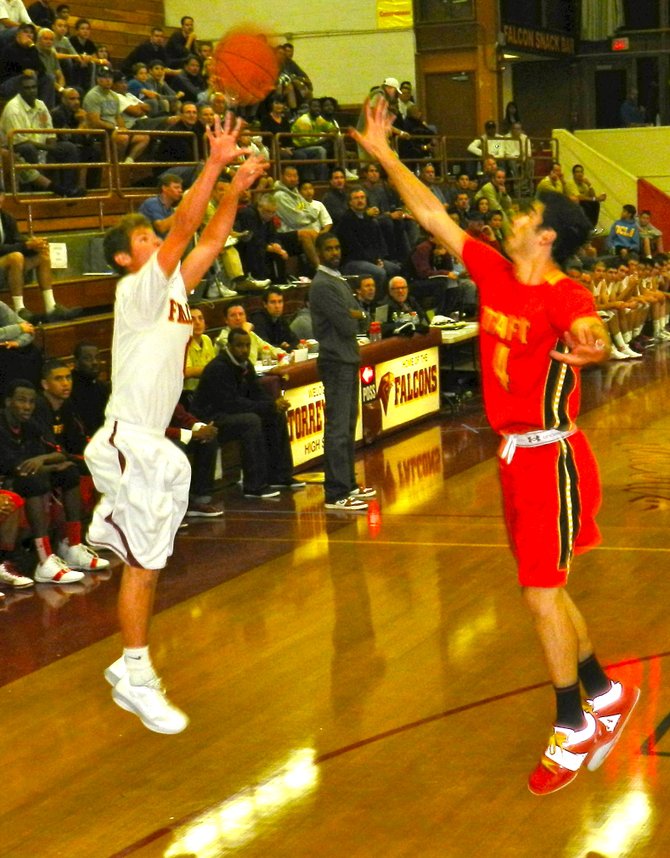 Torrey Pines guard Sean Murray shoots a three over Taft guard Kris Yanku