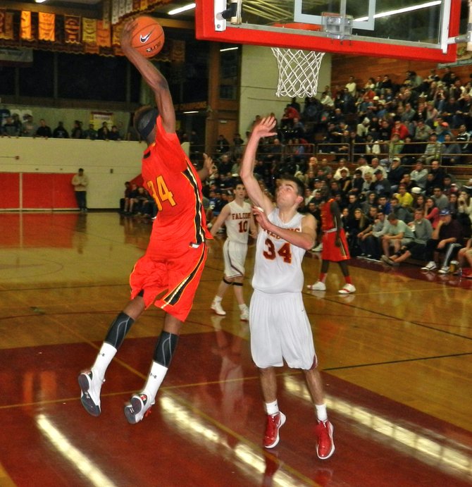 Taft forward Anthony January throws down a one-handed dunk over Torrey Pines forward Sean Milmoe