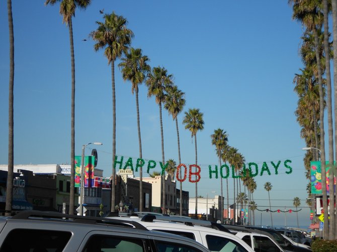 Festive holiday banners adorn Newport Avenye business district.