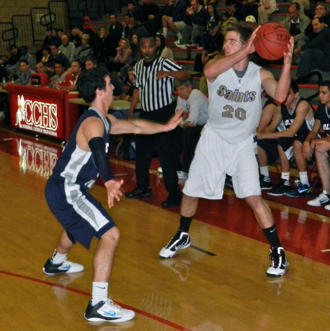 St. Augustine guard Drew Peterson guarded by College Park guard guard Layton Zinsmeister