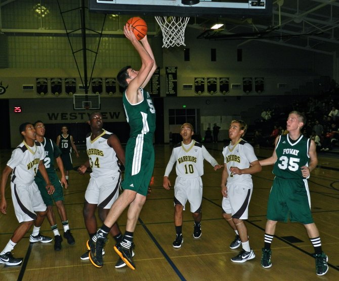 Poway center Sam Beeler goes up for a layup