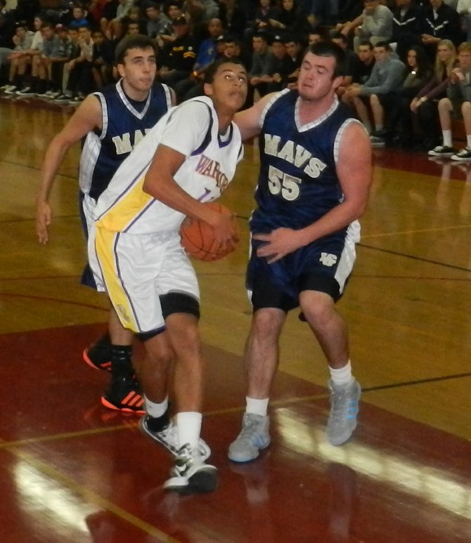 Righetti guard Cameron Walker drives to the hoop in front of La Costa Canyon forwards Zach Beery (left) and Erik Magnuson