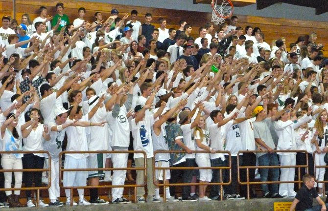 La Costa Canyon's white-clad student section cheers on the Mavericks against rival Torrey Pines