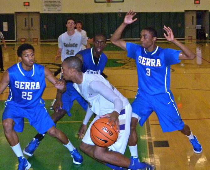 St. Augustine guard Brynton Lemar surrounded by three Serra defenders underneath the basket