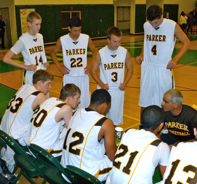 Francis Parker coach Jim Tomey talks to the Lancers during a timeout