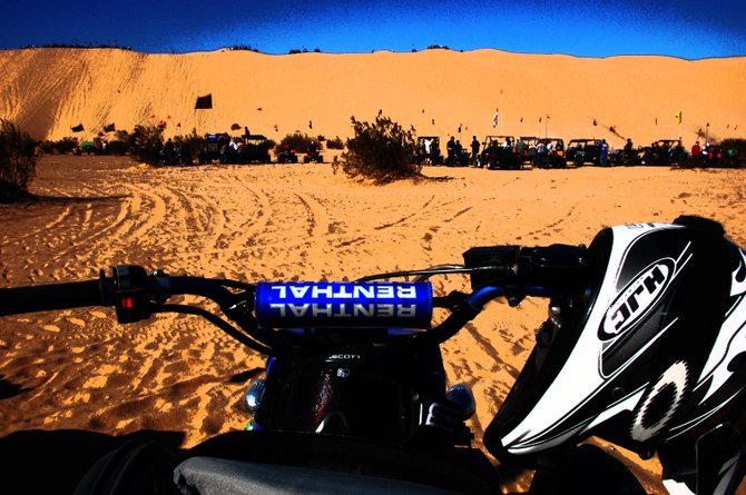 I spent my thanksgiving at Gordens Well, CA. This photo shows something I love to watch. I dont ride dirt bikes or quads but I love the desert! This is a photograph of a quad waiting to go up the Dunes.