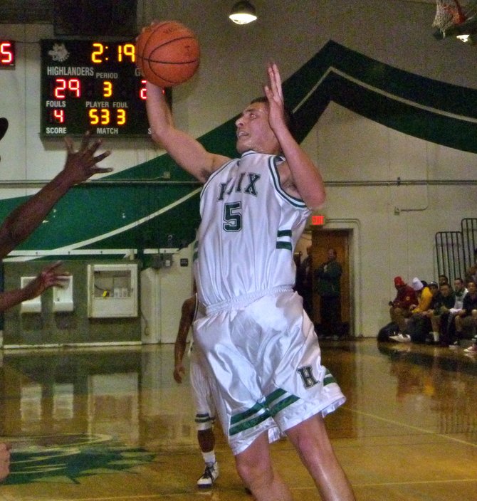 Helix forward Brian Valadez brings down a rebound with one hand