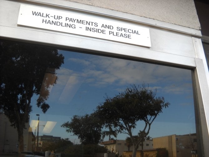 SDG&E office drive-thru with reflection on H St.