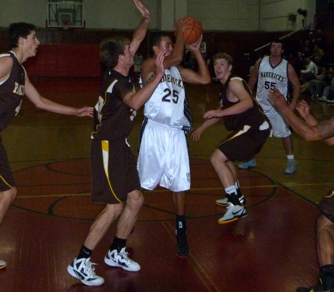 La Costa Canyon guard David Travers passes out of the lane between four Francis Parker defenders
