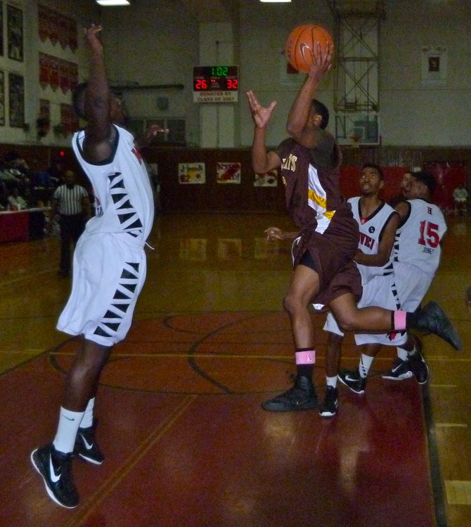 El Camino guard Imanni Sobers floats a shot over Hoover forward Jeremai Northard