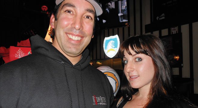 Nicky Rottens owner Nick Tomasello poses with server Jessica.