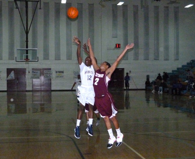 Morse guard Jah'mere Mitchell shoots a jumper over Sweetwater forward Raven Middleton