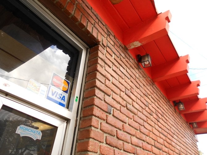 Colorful roof and brick facade of Roberto's Mexican food restaurant in Ocean Beach.