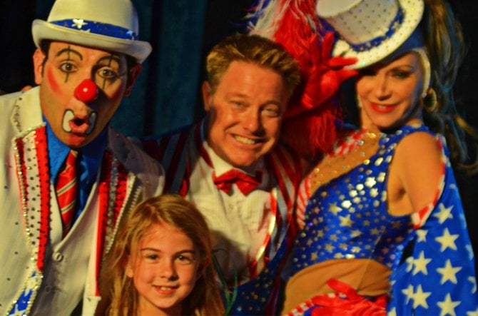 My daughter posing with Circus Vargus performers in Balboa Park.