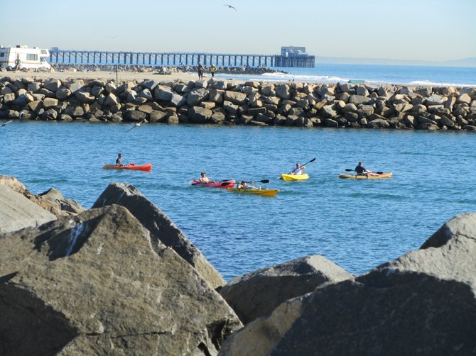 Rainbow of Kayaks in Oceanside Harbor...the blues and greens are coming soon :)  www.scripca.com