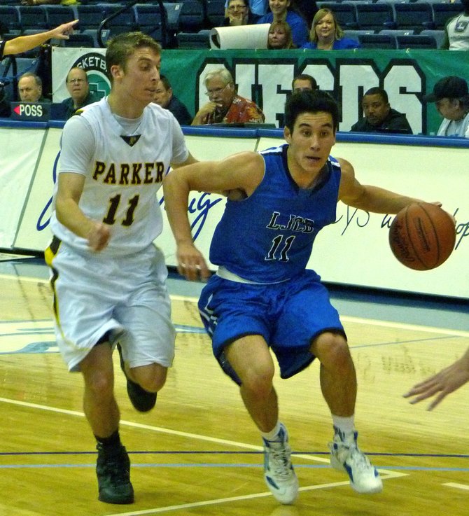 La Jolla Country Day guard Kai Tuites tries to shake Francis Parker guard Connor Polk on the dribble