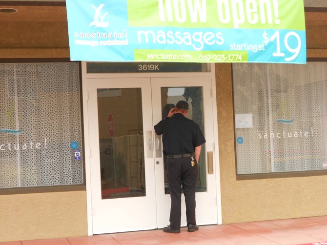 Security guard checking on new business along Midway Dr.