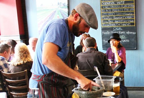 Local Habit chef Nick Brune mixes up a spicy, white anchovie-adorned Caesar salad, table-side, which was later extinguished by Pizza Port Carlsbad's Poor Vato IPA, a version of their Poor Man’s IPA served on nitro.
