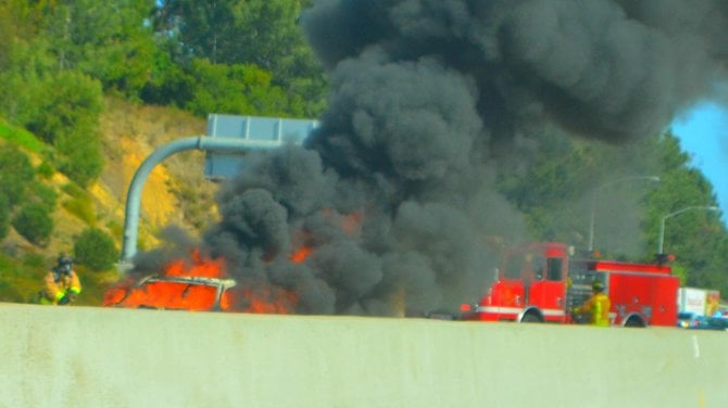 Firefighters extinguishing a small inferno that backed up traffic on the I5S., near Del Mar, on Sunday April 15th in the mid-morning.