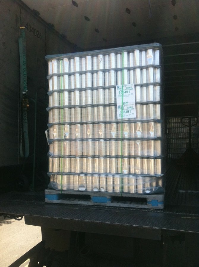 Naked empty cans sit ready for filling and labeling at Monkey Paw's East Village brewery.