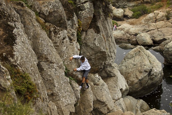 Climbing the rocks at the waterfall in Los Peñasquitos Canyon Reserve.  (Sorrento Valley)