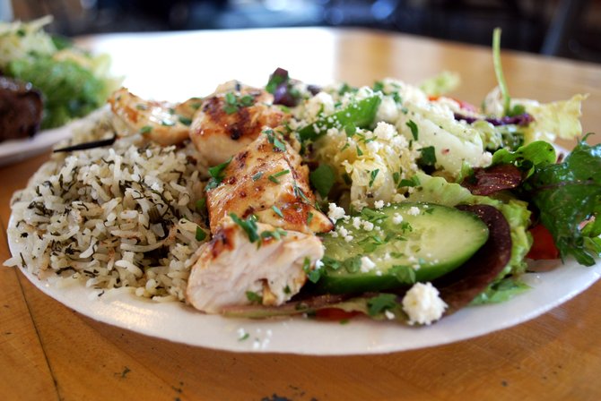 Chicken combo plate with herb rice and mixed salad