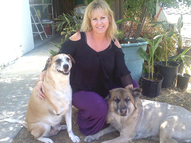Trina Vukov and her rescued mutts.  Courtesy photo.