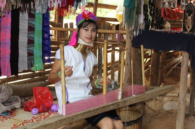 Long neck tribe in Chang Rai Thailand making wraps