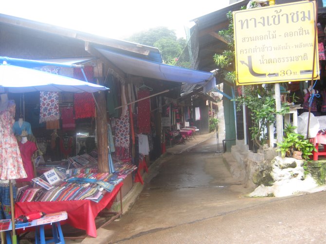 Colorful fabrics are displayed at a Hmong market in northern Thailand.