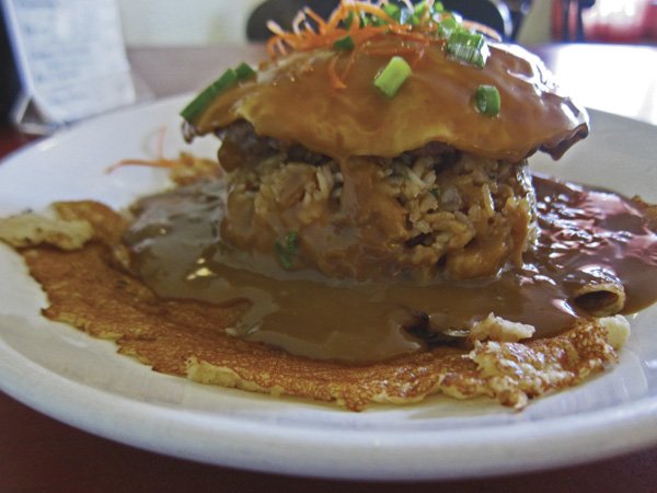 Island Style Cafe’s Koloko Moco — a hamburger patty, fried rice, eggs, and gravy served on a crepe.