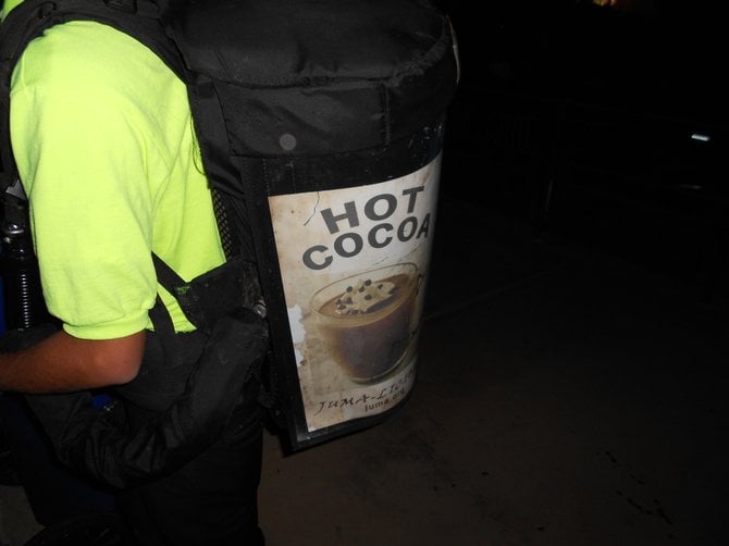 Hot cocoa guy selling warmth to chilled Cricket Amphitheater's concertgoers at Beach Boys show.