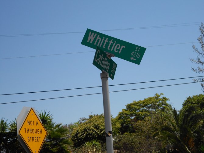 Crooked street sign in Ocean Beach near Voltaire St.