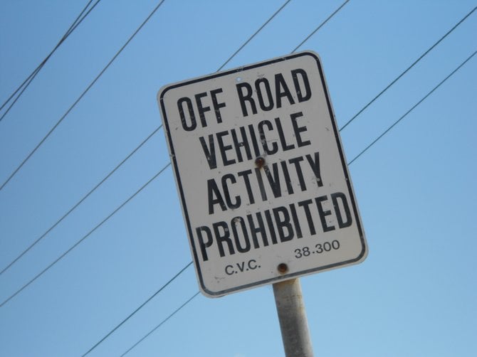 Caution sign across from Bill Cleator Park in Ocean Beach.