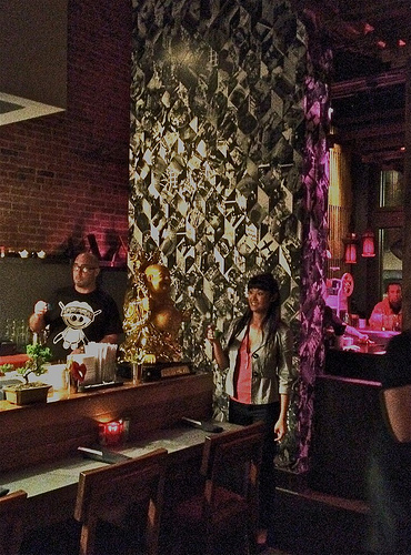 Chef/Owner Antonia Friscia and employee, Jamie, partake in communal sake shot.
