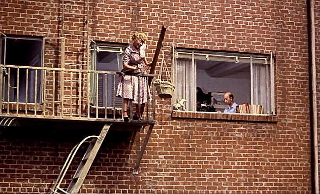 Sara Berner, the dog that knew too much, and Frank Cady in Alfred Hitchcock's "Rear Window" (1954).