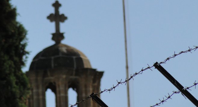 Evidence of a culture gap: barbed-wire barricade near Greek Orthodox church, Nicosia. 