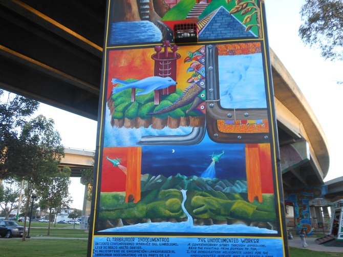Michael Schnorr's mural on a pillar: "The Undocumented Worker."