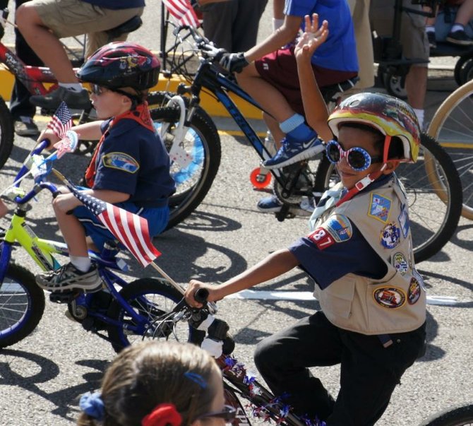 Boy scouts on bicycles. 