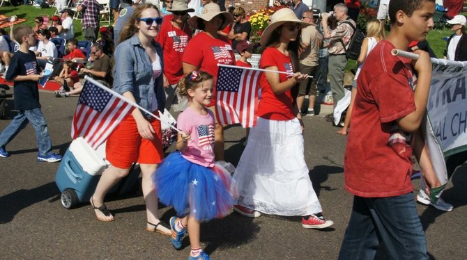 Families dressed  in red, white, and blue.  Photo Bob Weatherston. 