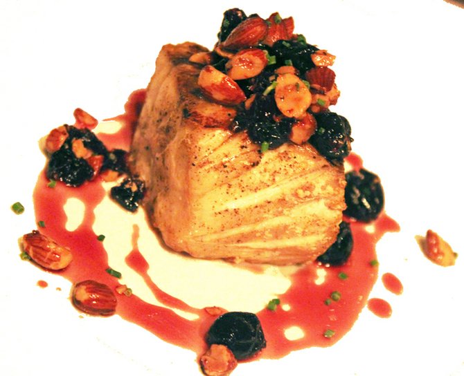 Bass with cherries and almonds.