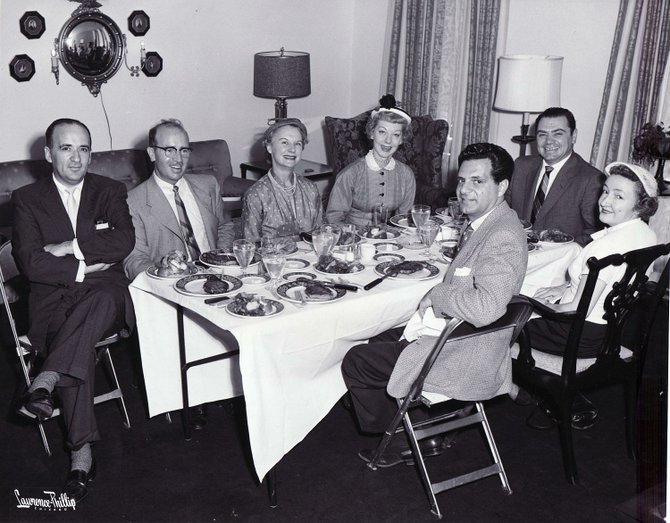 A 1956 candid of Ernie chowing down at the home of a Chicago journalist. Check out the size of those USDA plate-mates!