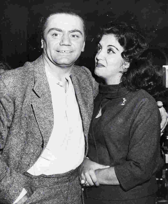 “HOLLYWOOD Dec. 9, 1959 – ‘I SURE LOVE HEEM.’ – Mexican actress Katy Jurado and actor Ernest Borgnine embrace as she joined him at the studio yesterday after flying here from her home in Cuernavaca, Mexico. She told newsmen she made the trip to find out when she and the Oscar-winning actor were going to marry. Borgnine explained he wants to make their home here, but she prefers Mexico. She invited those present at the reunion to ‘look at that man. I sure love heem!’”