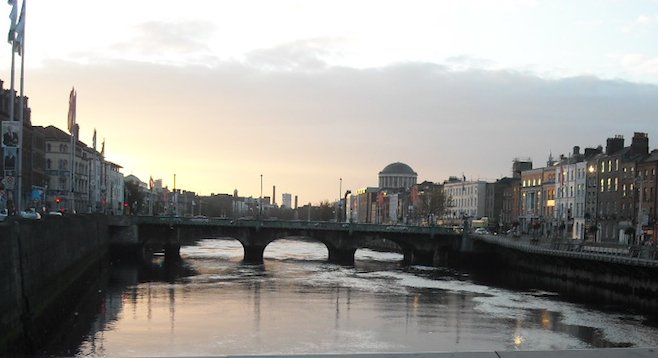 Dublin, bridge over the River Liffey at dusk. 