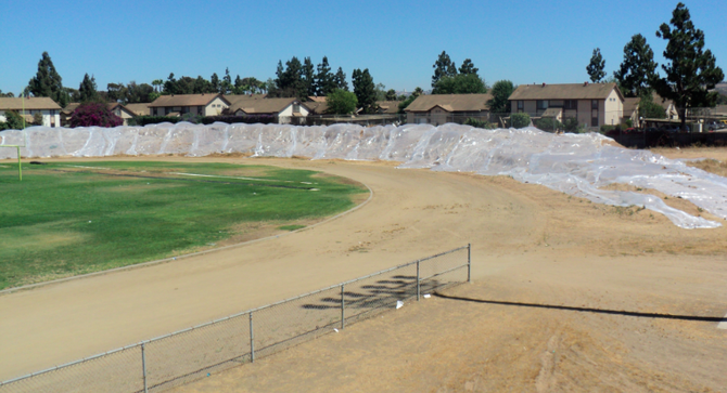 Origin of dirt (covered in plastic) at Southwest High is still under investigation