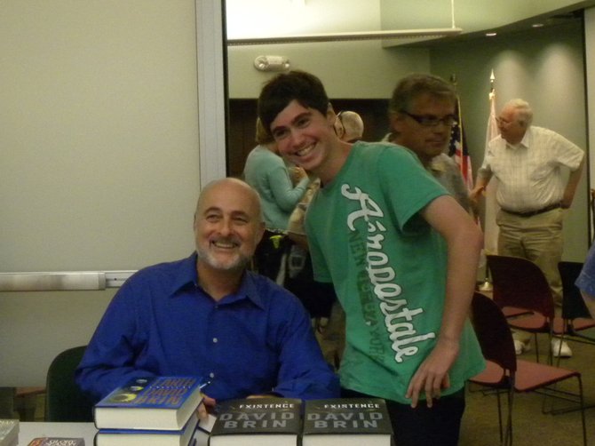 David Brin and a fan at a book signing on July 19.