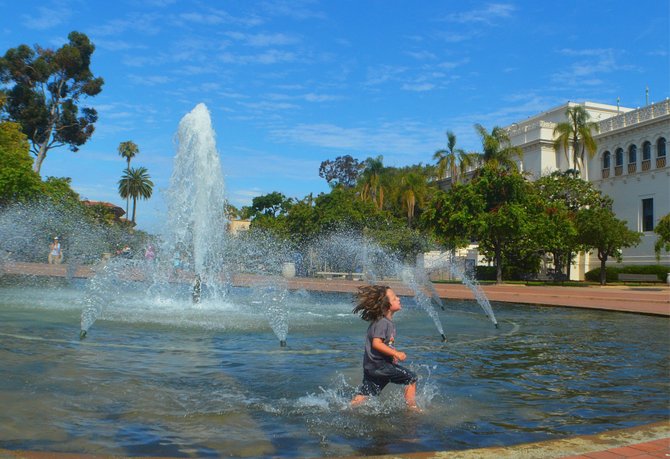 My son Fin frolicking at the fountain at Balboa Park