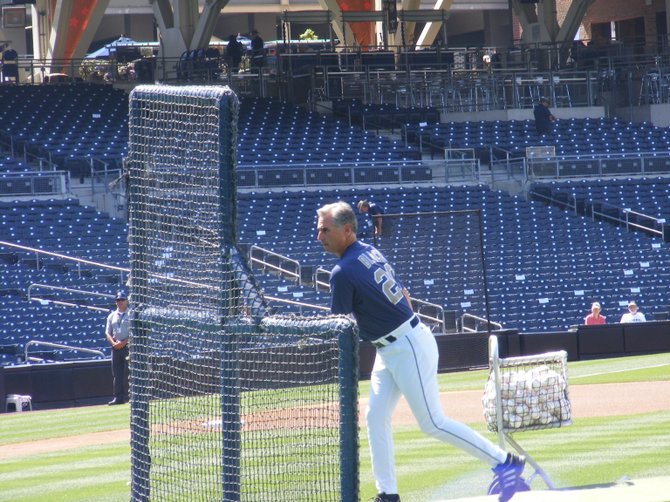 Padres manager Buddy Black throws batting practice. 