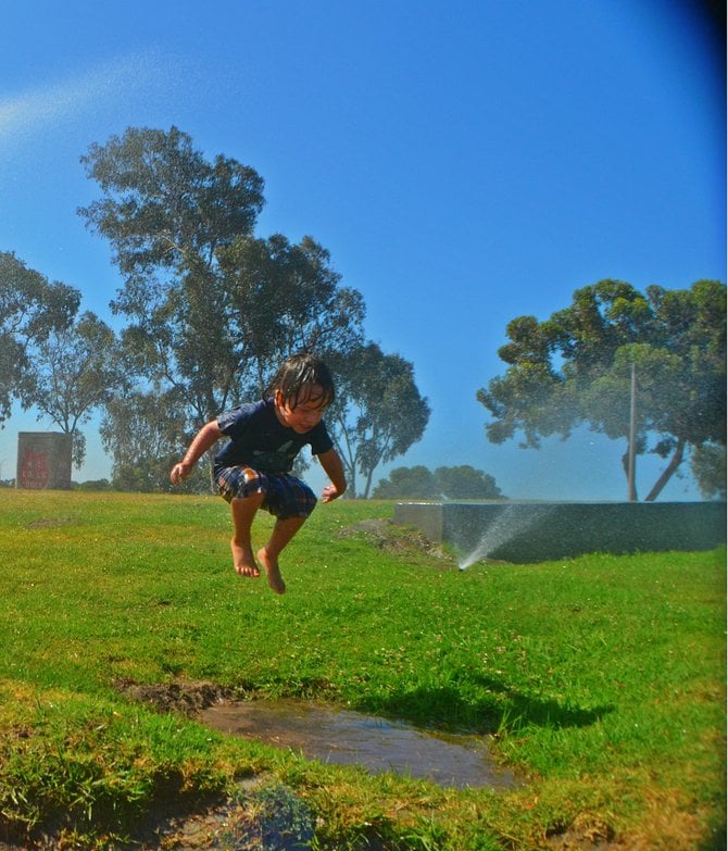 My son Fin, taking full advantage of the sprinklers at Mission Bay Park.