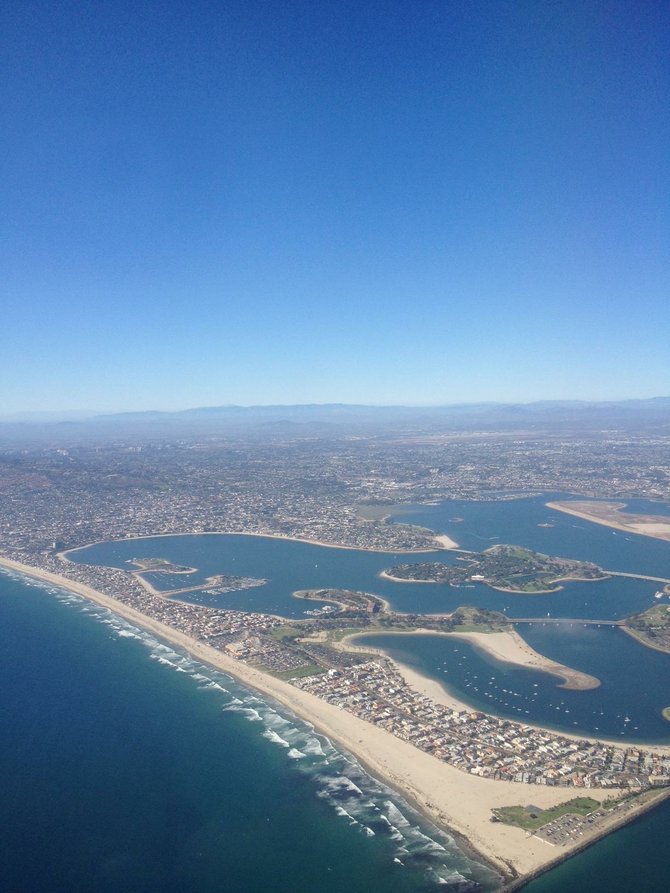A Photo i took with my I-phone flying over San Diego Coast Line on a Beautiful Sunny Day! No Filter used or Edit, Just the Actual Picture Featured! Its Crazy How well I-Phones can take pictures or just how Noticeably Beautiful Our San Diego Coast Line is!