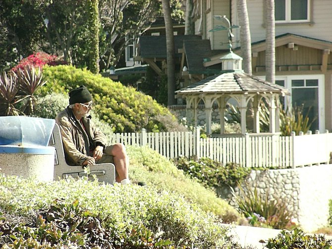 Man sitting on a bench in La Jolla. July 28, 2012.